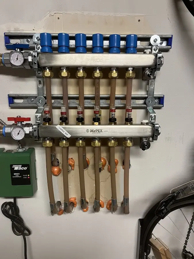 Plumber performing Water Heater Repair at a residential property in Albertville